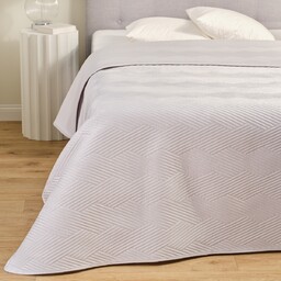 Jednokolorowa narzuta na łóżko z wytłoczonym wzorem Trialett