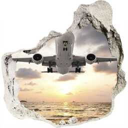 Foto zdjęcie dziura na ścianę Samolot nad morzem
