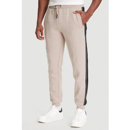 GUESS Beżowe spodnie męskie z lampasami Mickey