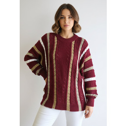 Ażurowy sweter damski oversize w pionowe paski