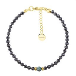 Bransoletka z czarnymi turmalinami i szmaragdem.