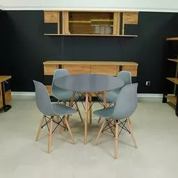 Okrągły stół w zestawie z nowoczesnymi krzesłami