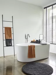 Okrągły dywanik łazienkowy Shaggy świetnie sprawdzi się w łazience