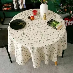 Okrągły obrus na stół w urocze zielone śnieżynki Okrągły obrus na stół w urocze zielone śnieżynki