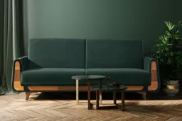 Zielona sofa rozkładana w stylu retro